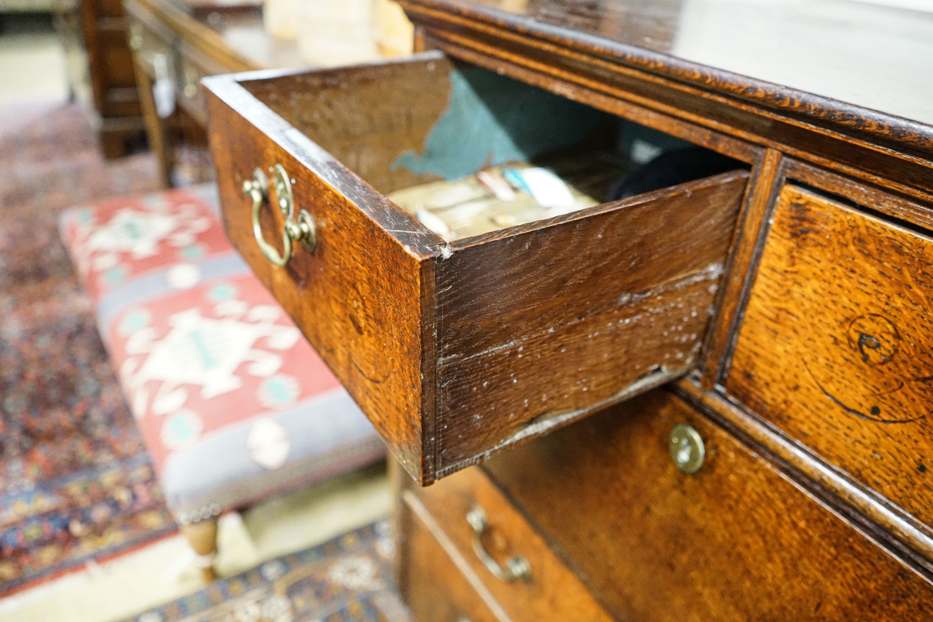 A George III oak chest of five drawers, on bracket feet, width 90cm, depth 52cm, height 103cm